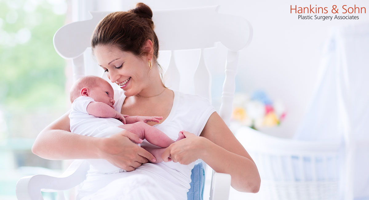 woman holding a newborn baby