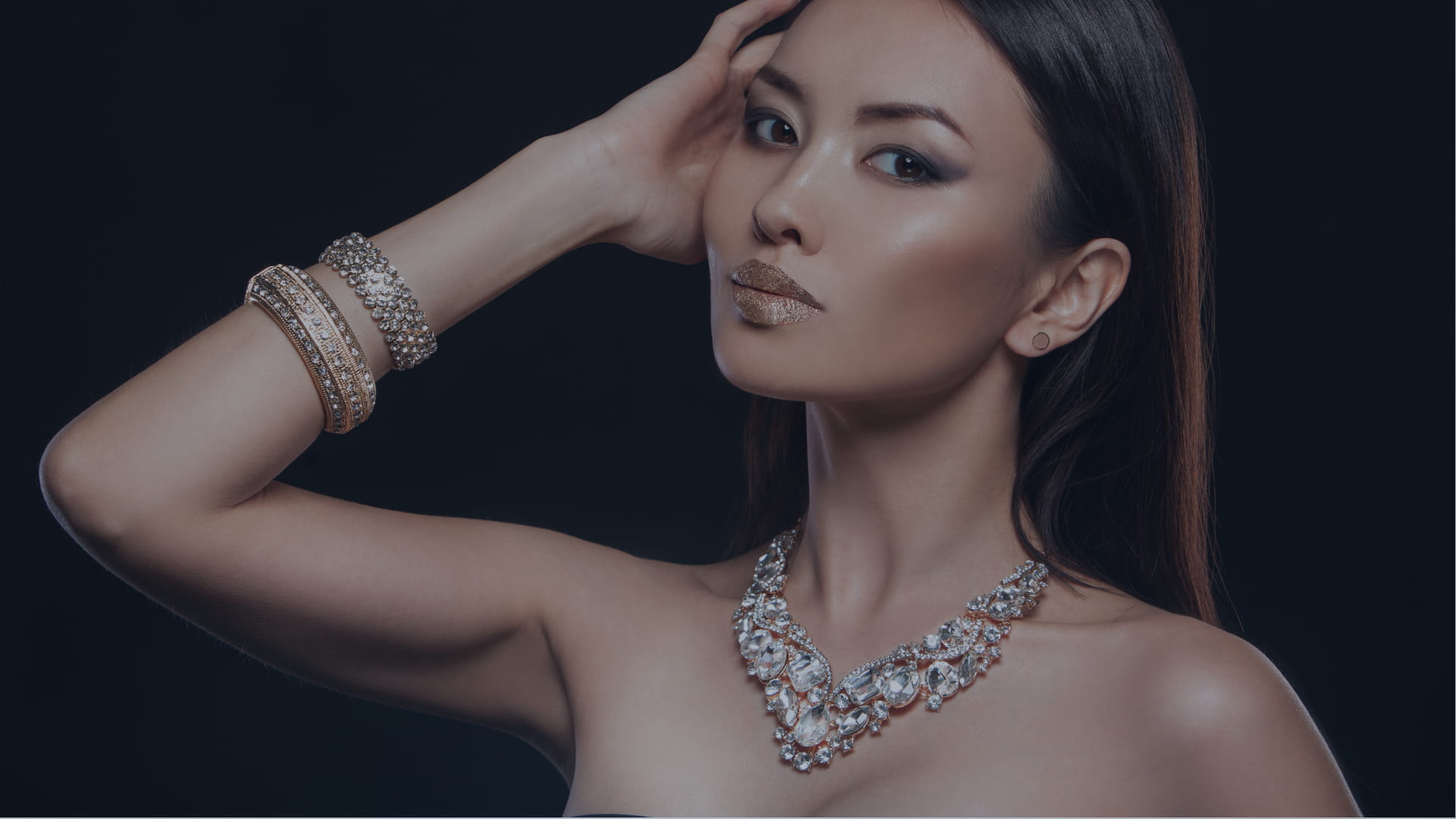 Elegant Asian woman wearing high fashion jewelry