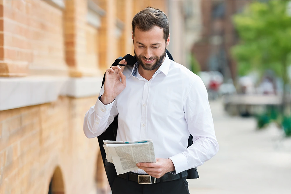 confident business man in 40's walking through town